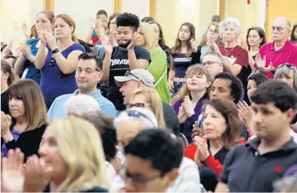  ??  ?? The crowd cheers during a Town Hall for Our Lives forum Saturday in Pembroke Pines hosted by U.S. Rep. Debbie Wasserman Schultz.