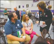  ?? (Democrat-Gazette file photo) ?? Mosemarie Boyd (right) greets Bernie Sanders supporters Chad and Susan Easley of Dover during a 2016 state Democratic Party caucus session in Conway. Now, Boyd is running a low-budget national campaign for president.