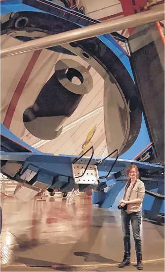  ?? CONTRIBUTE­D ?? PHD candidate Anna O’grady stands by one of the Magellan Telescopes at Las Campanas Observator­y in Chile.