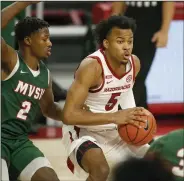  ?? (NWA Democrat-Gazette/David Gottschalk) ?? Arkansas freshman guard Moses Moody said he and his teammates were pleased the Razorbacks were able to schedule tonight’s game against Southern. “Just having that routine, I’ve been liking it so far,” he said. “So I didn’t want that to end this early and have to wait a whole other week before we play.”