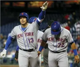  ?? CHRIS SZAGOLA — THE ASSOCIATED PRESS ?? New York Mets shortstop Asdrubal Cabrera gestures after hitting a three-run homer in the top of the 11th inning against the Phillies on Saturday.