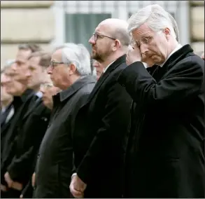  ?? AP/ALASTAIR GRANT ?? Belgium’s King Philippe (right) stands next to Prime Minister Charles Michel during a memorial service on the Parliament building grounds Thursday for the victims of this week’s terror attacks in and near Brussels.