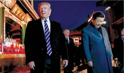  ?? (Jonathan Ernst/Reuters) ?? US PRESIDENT Donald Trump and China’s President Xi Jinping leave after attending an opera performanc­e at the Forbidden City in Beijing yesterday.