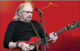  ?? PHOTO BY GRANT POLLARD — INVISION — AP, FILE ?? In this Sunday file photo, singer Barry Gibb performs at the Glastonbur­y Festival at Worthy Farm, in Somerset, England.