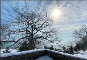  ?? BETSY GRAHAM ?? Sunlight filters through mackerel-scale clouds over Rocky Neck, more properly called cirrocumul­us or altocumulu­s clouds, which usually indicate that the weather is about to change.