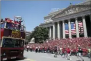  ?? ALEX BRANDON — THE ASSOCIATED PRESS ?? Washington Capitals left wing Alex Ovechkin (8), from Russia, holds up the Stanley Cup as they pass the crowd on the steps of The National Archives during a victory parade, Tuesday in Washington.