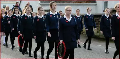  ?? ?? The Girls’ Brigade make their way to the church service in Ballinamal­lard.