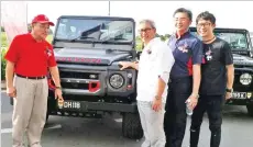  ??  ?? THAT’S MINE?: DH stands for Datuk Hajiji, said Local Government and Housing Minister Datuk Seri Hj Hajiji Hj Noor (left) jokingly to Datuk Henry Hing, the owner of this Land Rover (second left). Hing, who is the Group Managing Director of Angkatan...