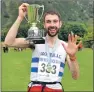  ?? 20_ f36benrace­01 ?? FIVE IN A ROW: Finlay Wild celebrates winning the Ben Nevis race for the fifth year running, the only person to do so, at last
year’s event