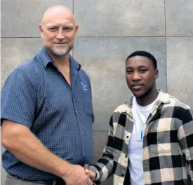  ?? ?? Richards Bay High School principal Herman Muller with star matriculan­t Andile Ntenga