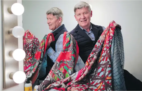  ?? JEFF MCINTOSH/THE CANADIAN PRESS ?? Designer Jean-Michel Gires’ colourful silk scarves are made in Indonesia — homeland of partner Agung Nugrahaeni. His leggings are made in Montreal.