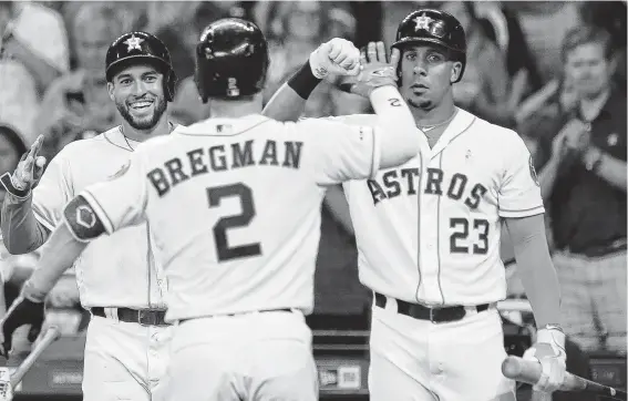  ?? Yi-Chin Lee / Staff photograph­er ?? When the All-Star Game arrives July 9 in Cleveland, these three Astros will be reunited as starters: George Springer, from left, Alex Bregman and Michael Brantley.