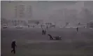  ?? AFP/Getty ?? A man drags a cart across a square in Rason. People who escaped from North Korea’s prisons say inmates are used as draught animals. Photograph: Ed Jones/