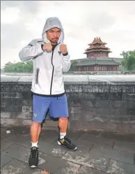  ?? PROVIDED TO CHINA DAILY ?? Manny Pacquiao, the legendary 38-year-old Filipino boxer, warms up at Jingshan Park during a promotiona­l visit to Beijing on Saturday.