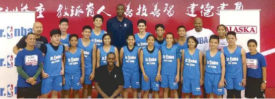  ??  ?? Members of the Phl Jr. NBA/Jr. WNBA delegation pose with NBA legend Dikembe Mutombo during their Jr. NBA Experience at the Dongguan Basketball School, an NBA Training Center in China recently. The Filipino kids, all products of the Jr. NBA/Jr. WNBA...