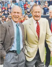  ?? Associated Press file ?? Former Presidents George W. Bush, left, and his father, George H.W. Bush, take in a Houston Texans football game in October 2009 in Texas.