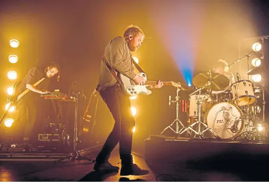  ??  ?? LOUD AND PROUD: Frightened Rabbit – Simon Liddell, Scott Hutchison and Grant Hutchison – performing on stage in London.