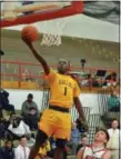  ?? PAUL DICICCO — THE NEWS-HERALD ?? Euclid’s Garvin Clarke goes in for a layup past Mentor’s Nick Ventura on Feb. 13 at Mentor. Clarke had 23 in the Panthers’ win.