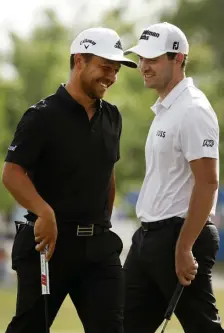  ?? GETTy iMaGES ?? TEAMWORK: Xander Schauffele and Patrick Cantlay react after putting in to win on the 18th green during the final round of the Zurich Classic of New Orleans.