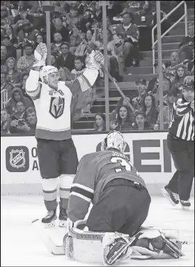  ?? AP PHOTO ?? Vegas Golden Knights forward Reilly Smith, top, celebrates after scoring against San Jose Sharks goalie Martin Jones on Monday. Vegas won on the road, 4-3.