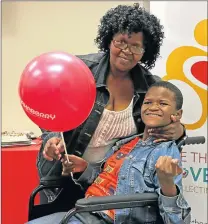  ?? Picture: MADELEINE CHAPUT ?? HELPING HAND: Nondumiso Mthayeni and her daughter, Indokuhle, who received a specialise­d wheelchair at the eighth PnA wheelchair handover. Indokuhle has cerebral palsy