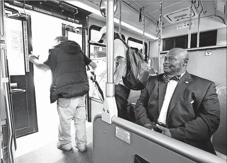  ?? [FRED SQUILLANTE/DISPATCH] ?? Andrew “Drew” Jordan, right, internatio­nal president of Local 208 of the Transporta­tion Workers Union, rides on the CBUS downtown. As COTA is nearing autonomous transporta­tion, Jordan is gearing up to negotiate for drivers who fear lost jobs. “They...