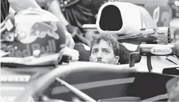  ??  ?? Red Bull’s F1 driver Daniel Ricciardo of Australia in the team’s garage during the Abu Dhabi Grand Prix in Yas Marina Circuit, Abu Dhabi United Arab Emirates. — Reuters photo