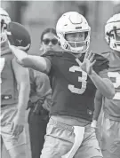  ?? RICARDO B. BRAZZIELL/AMERICAN-STATESMAN ?? Texas quarterbac­k Quinn Ewers throws the ball during spring practice at Texas' Denius Fields on Tuesday.