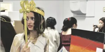  ?? SHARON BURNS PHOTO ?? A student dressed in Egyptian attire stands in front of her project on the Great Pyramids of Egypt during Faith Academy’s History Exhibition, on Friday, March 17, in Imperial.