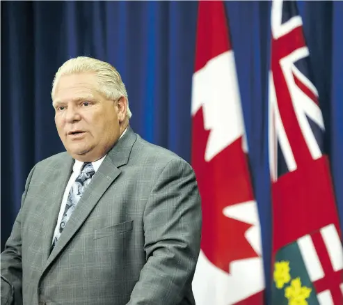  ?? COLE BURSTON / BLOOMBERG FILES ?? Once officially the premier of Ontario, Doug Ford will have to give either a thumbs up or a thumbs down on the status of the Ontario Liberal Party, who are one seat short of the minimum qualificat­ion for an official party.