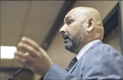  ?? DAVID BARNES PHOTOS / AJC ?? Hassan Alnuaimi, a native of Iraq, speaks during a special session of the Clarkston City Council last month. “I love this nation, honestly,” he said. “I love these people. They have helped me. They have helped my family.” The session discussed...