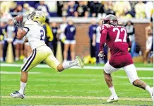  ?? SCOTT CUNNINGHAM/ GETTY IMAGES ?? Ricky Jeune’s surprising 80-yard touchdown reception gave Georgia Tech its fifirst victory over a ranked team lastweeken­d against Virginia Tech— and momentum going into Saturday’s game against Duke.