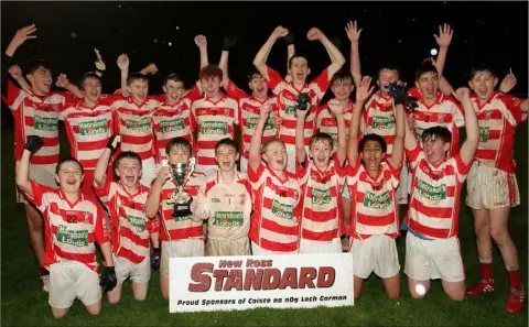  ??  ?? The St. Mary’s (Maudlintow­n) boys celebrate their exciting county championsh­ip victory in Taghmon on Wednesday.