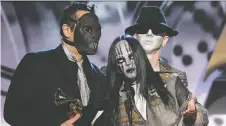  ?? GETTY IMAGES ?? Joey Jordison, centre, seen at the 2006 Grammy Awards with his Slipknot bandmates Paul Gray, left, and Sid Wilson, has died.