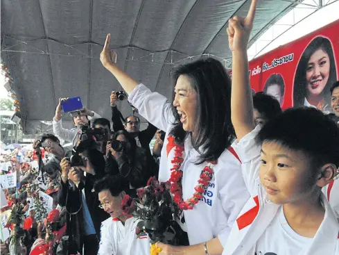  ?? BANGKOK POST ?? Former prime minister Yingluck Shinawatra on her campaign trail prior to the general election in 2011. Her rice pledging scheme policy helped her secure victory.