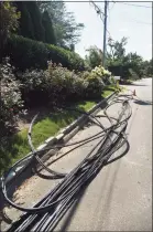  ?? Brian A. Pounds / Hearst Connecticu­t Media file photo ?? Downed power lines in the aftermath of a Tropical Storm Isaias tornado on Surf Road in Westport on Aug. 10, 2020.