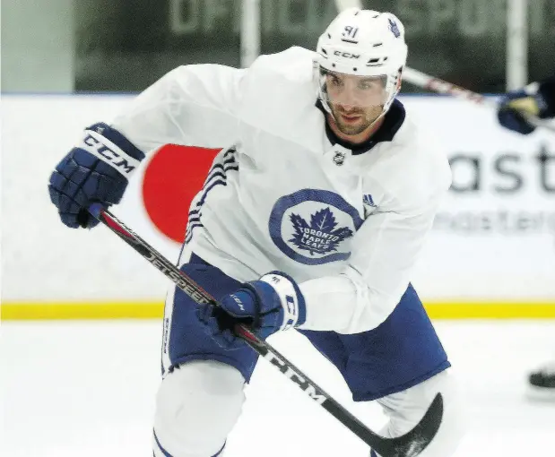  ?? DAVE ABEL / POSTMEDIA NEWS ?? Newly-acquired Toronto Maple Leaf John Tavares intercepte­d two passes on his first practice shift and later scored a goal.