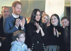  ??  ?? Chelsea Cameron, right, met Prince Harry and Meghan Markle during their visit to Edinburgh. Picture: PA.