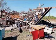  ??  ?? Several businesses near Interstate 35 and State Highway 9 were damaged Saturday as a storm rolled through the Norman area.