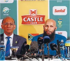  ?? PHOTO: GETTY IMAGES ?? Haroon Lorgat, left, at Hashim Amla’s retirement press conference this week. Many people believe Amla was first given a chance in the South African team because of a race quota, which Lorgat denies.