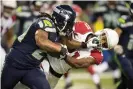  ??  ?? Marshawn Lynch stiff-arms Arizona Cardinals cornerback Patrick Peterson during a 2015 game. Photograph: Troy Wayrynen/USA Today Sports