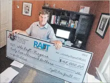  ?? BOB TYMCZYSZYN
THE ST. CATHARINES STANDARD ?? Mike Lethby from RAFT with a giant cheque from Fight for Youth.