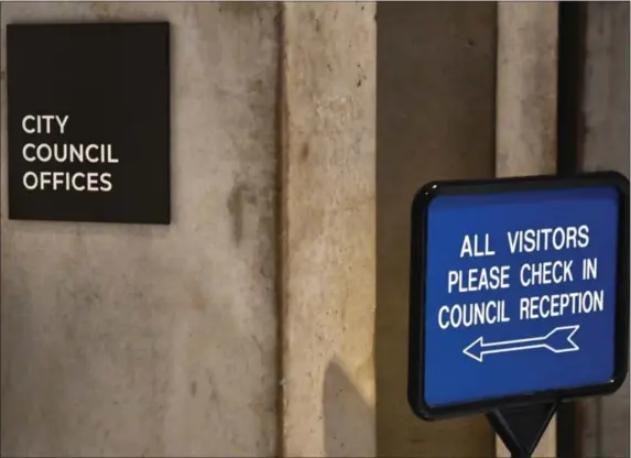  ?? CHRIS CHRISTO — BOSTON HERALD ?? Signs direct people to city council offices where council President Ed Flynn wants colleagues to open their doors.