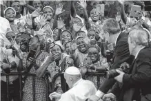  ?? Jerome Delay/associated Press ?? Pope Francis greets the crowd Thursday at Notre Dame du Congo cathedral in Kinshasa, Congo.