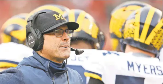  ?? JOE MAIORANA/USA TODAY SPORTS ?? Jim Harbaugh’s Michigan squad lost all chance for a Big Ten title and College Football Playoff berth with the Buckeyes’ seventh consecutiv­e victory over the Wolverines, 62-39.