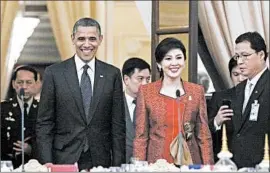  ?? JASON REED/REUTERS PHOTO ?? President Barack Obama and Thailand’s Prime Minister Yingluck Shinawatra arrive for dinner at the Government House in Bangkok on Sunday. He visits Myanmar on Monday.