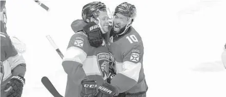  ?? LYNNE SLADKY/AP ?? Florida Panthers left wing Carter Verhaeghe, left, celebrates with Anthony Duclair after scoring the winning goal during overtime against the Pittsburgh Penguins on Thursday in Sunrise.