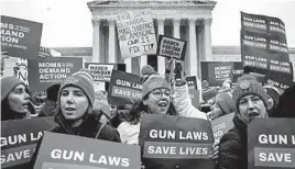  ?? DREW ANGERER/GETTY ?? Gun-control advocates rally in front of the U.S. Supreme Court on Monday.