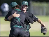  ?? PHOTO BY ALEX GALLARDO ?? Bonita pitcher Garrett Patterson, right, celebrates with left fielder Jared Brunk after defeating Damien 6-1on Friday.