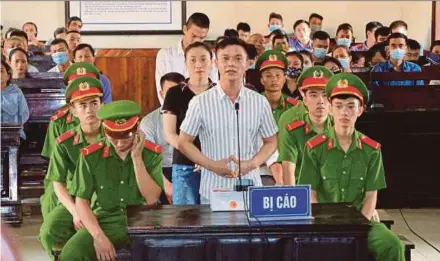  ?? AFP PIC ?? One of the defendants speaking in a court in Ha Tinh province on Monday. They were involved in the traffickin­g of several Vietnamese to the UK who died in a refrigerat­ed truck tragedy last year.
